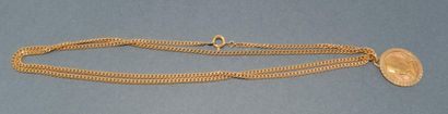 PENDENTIF en or jaune 18k (750/°°) figurant...