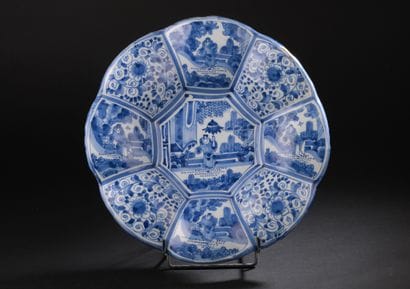Delft
Round dish with gadrooned rim decorated...