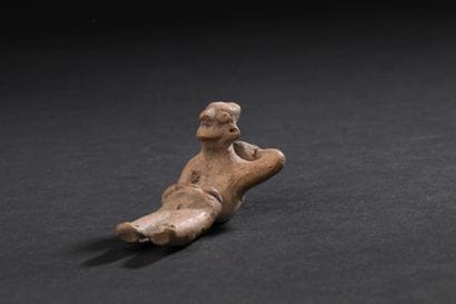 Figurine depicting a bearer with his back...