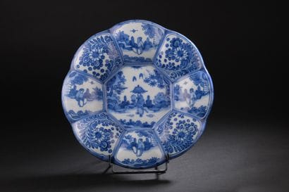 Delft
Round dish with gadrooned rim decorated...