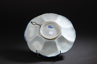 Delft
Round dish with gadrooned rim decorated...