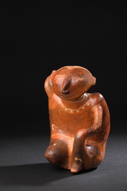 Anthropomorphic vase depicting a seated
offering...