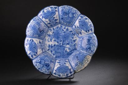Delft
Round dish with gadrooned rim decorated...