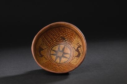 Bowl on pedestal with red and brown four-part
brown...
