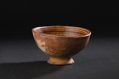 Bowl on pedestal with red and brown four-part
brown...