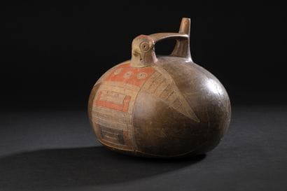 Singing vase featuring a bird.
The oblong...