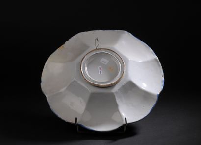 Delft
Round dish with gadrooned rim decorated...