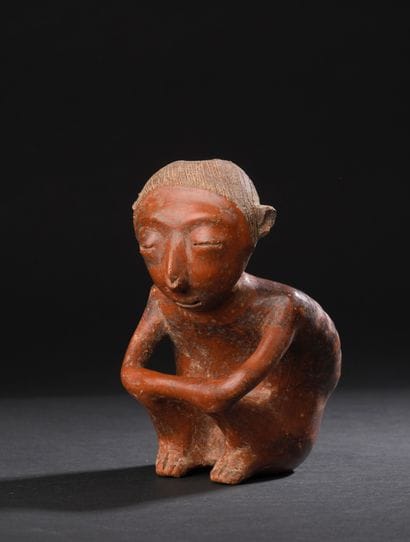 Anthropomorphic statuette depicting a seated
seated...