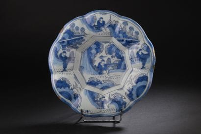 Delft
Round dish with gadrooned rim decorated...