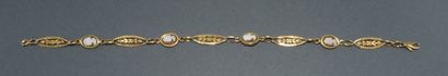 BRACELET in 18k (750/°°) yellow gold, filigree...