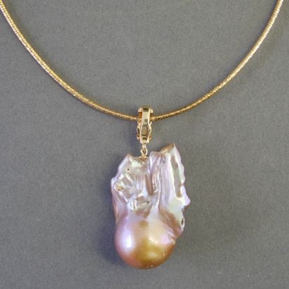 Gilded metal COLLAR with a large iridescent...