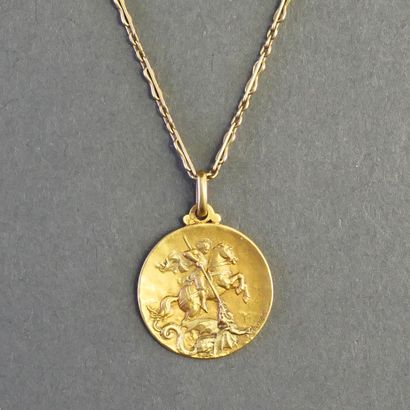 MEDAL AND CHAIN in 18k (750/°°) yellow gold,...