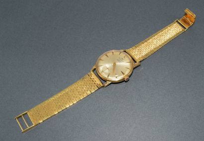 BRACELET WATCH in 18k (750/°°) yellow gold...