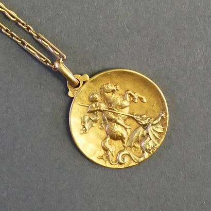 MEDAL AND CHAIN in 18k (750/°°) yellow gold,...