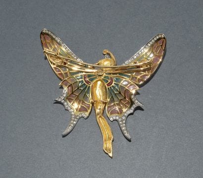 18k (750/°°) yellow gold and platinum brooch...