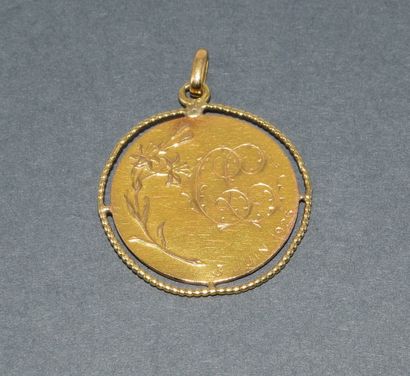 MEDAL in 18k (750/°°) yellow gold, featuring...