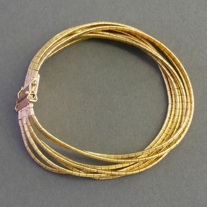 18k (750/°°) yellow gold omega-mesh multi-strand...