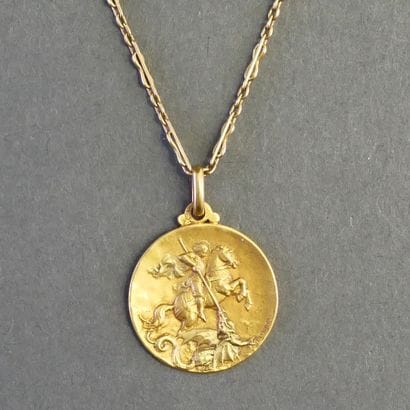 MEDAL AND CHAIN in 18k (750/°°) yellow gold,...