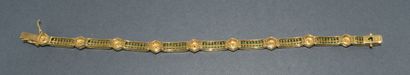 BRACELET in 18k (750/°°) yellow gold adorned...