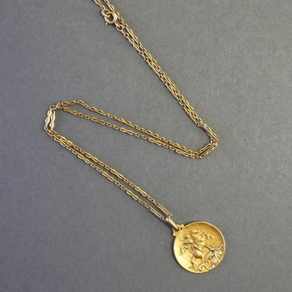 MEDAL AND CHAIN in 18k (750/°°) yellow gold,...