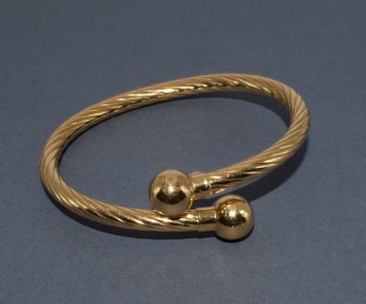 BRACELET JONC esclave en or jaune 18K (750/°°)...