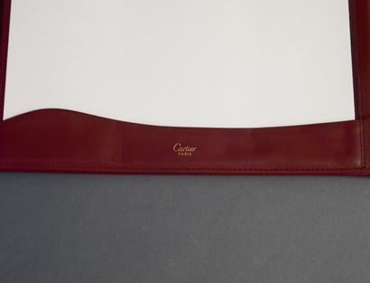 CARTIER
Red leather travel desk set with...