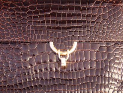 LANCEL
Dark brown crocodile-skin handbag...