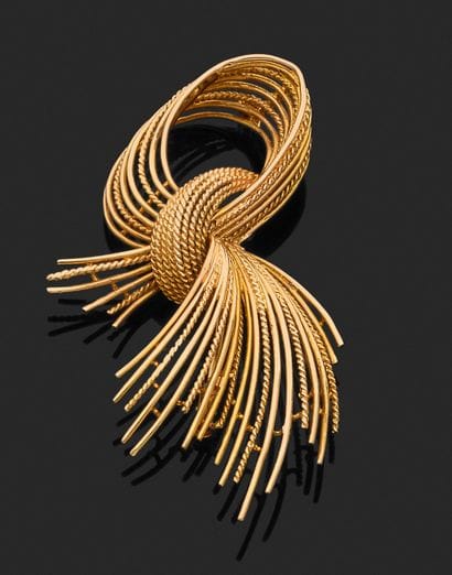 ELEGANT BROOCH in 18k yellow gold (750/°°)...