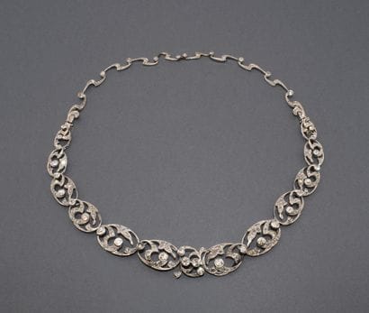 Convertible platinum necklace with a mascaron...