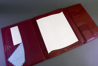 CARTIER
Red leather travel desk set with...