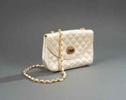 CHANEL, circa 1980–1985
Small quilted satin...