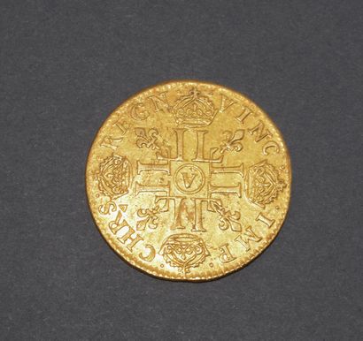 Pièce en or 917/°°
LOUIS XIV : Louis d’or...