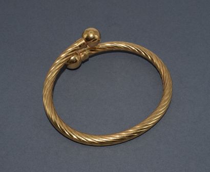 BRACELET JONC esclave en or jaune 18K (750/°°)...