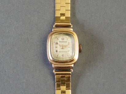 HUMA
WOMEN'S WATCH with an 18k yellow gold...