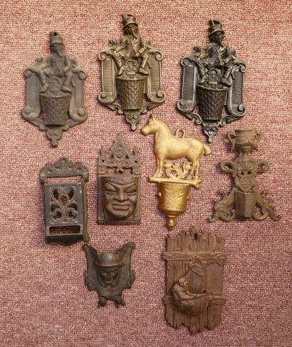 Set of 8 cast-iron wall-mounted match/pyrogen...