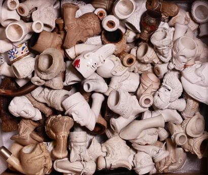 Lot of black, red and glazed clay pipe hearths....