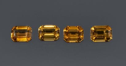 Set of 4 rectangular, faceted Cognac citrines....