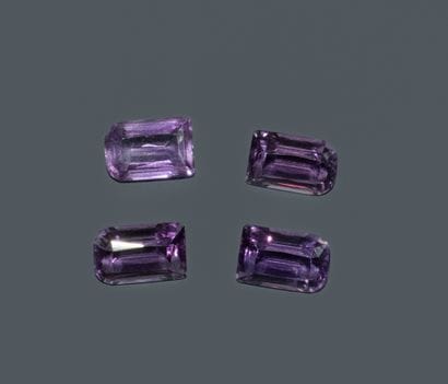 Set of 4 assorted fancy-cut amethysts.
Total...