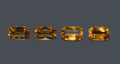 Set of 4 rectangular, faceted Cognac citrines....