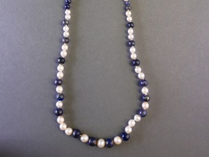 Necklace featuring pearls and cascading blue...