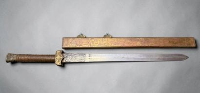 Sabre chinois
Monture et fourreau en laiton,...