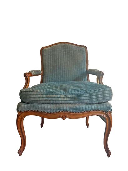 Molded and carved wood armchair with curved...