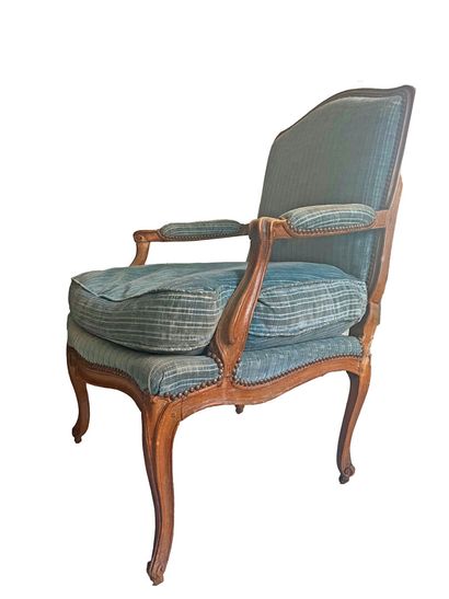 Molded and carved wood armchair with curved...