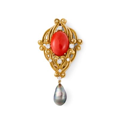 CORAL DIAMOND BROOCH
This crest-shaped brooch...