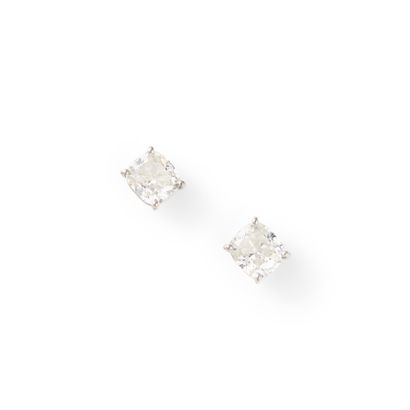 PAIR OF EARRINGS
each adorned with a cushion-cut...