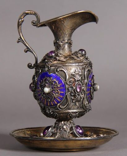 Ewer and its 800°/°° silver and vermeil display,...