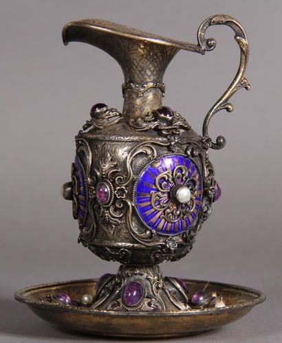 Ewer and its 800°/°° silver and vermeil display,...