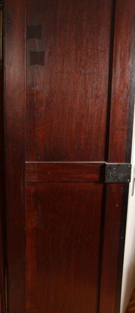 Moulded mahogany cabinet opening by two leaves,...