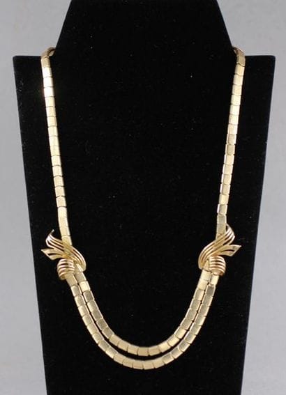Necklace with flat links decorated with two...
