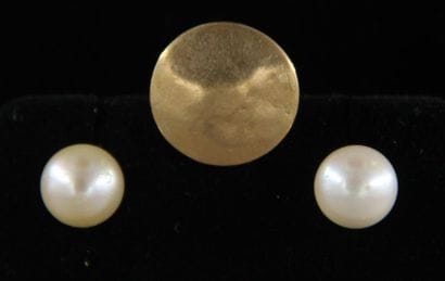 One breastplate button and one pair of ear...